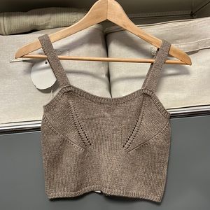 Knit cropped tank top with detailed stitching. Size S